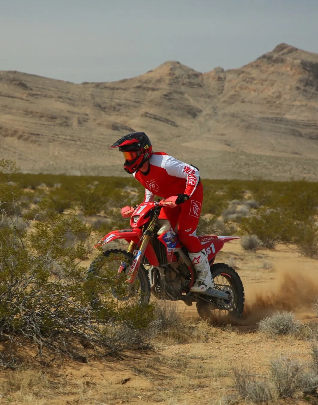 Wyatt Cooper racing a red Honda through desert brush